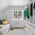 "Bright small living room with mirrors and neutral walls to make it look bigger"