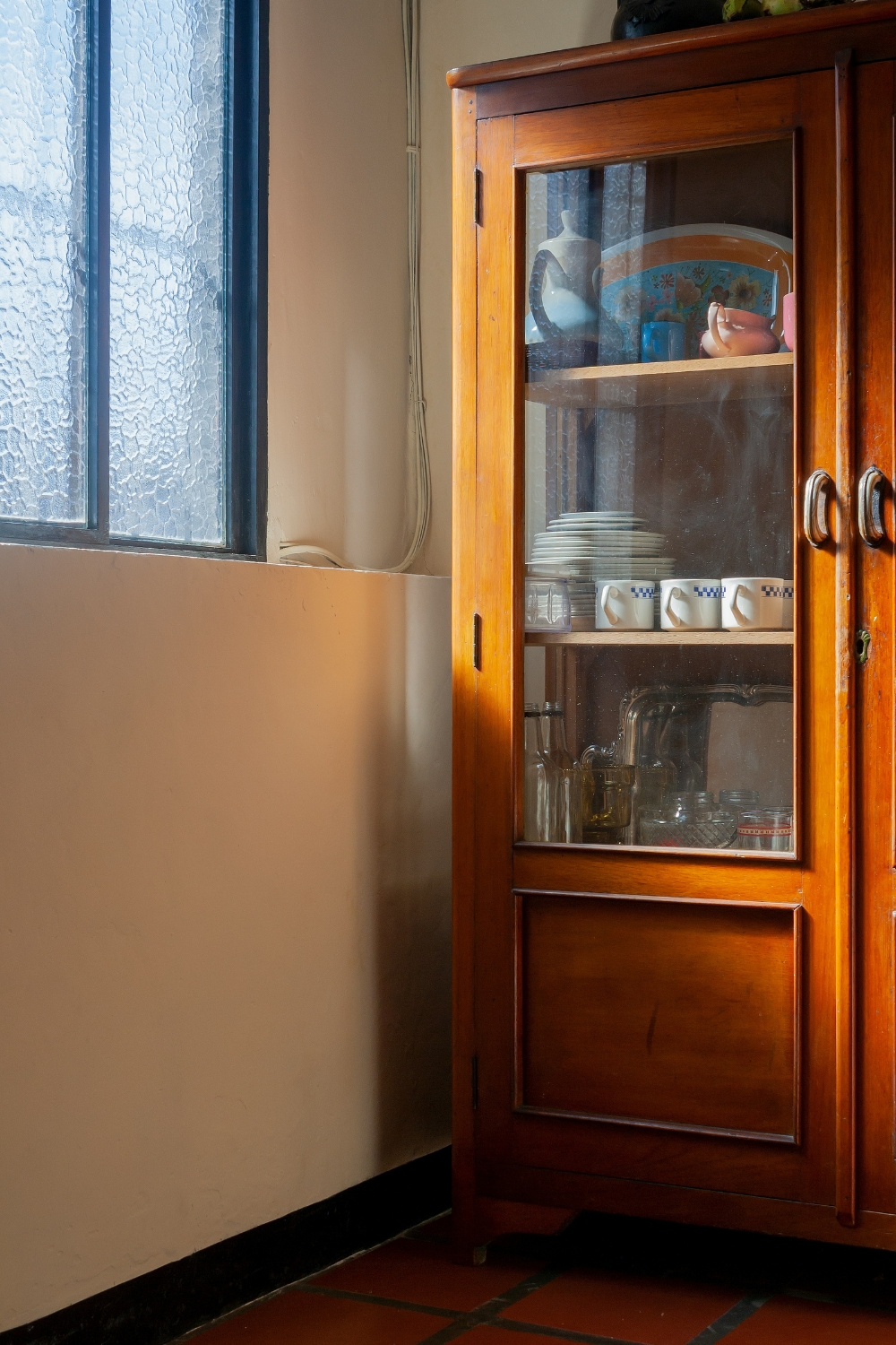 Lazy Susan in corner cabinet holding spices and condiments