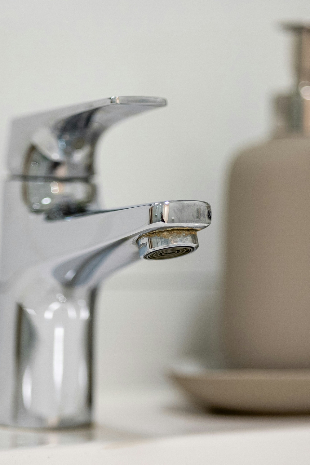 Touchless smart faucet installed in a modern small kitchen