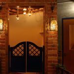 Besuerte LED string lights hanging on a wall, glowing softly with warm light, featuring a 6-hour timer for indoor and outdoor decoration