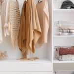 "ClearSpace clear plastic storage bins used as pantry organizers in a kitchen cabinet"