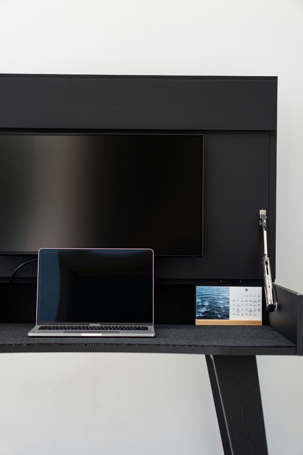 “Compact wooden TV stand with storage drawers”