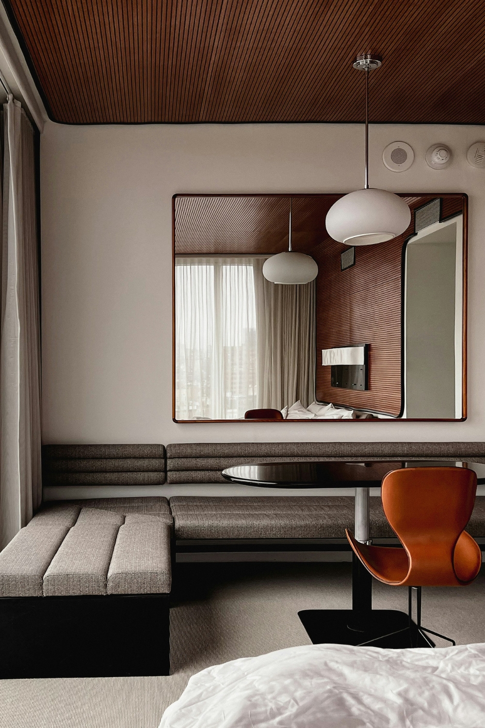 “Minimalist bedroom with neutral tones and cozy textiles”