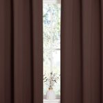 NICETOWN chocolate brown blackout curtains hanging in a modern nursery bedroom