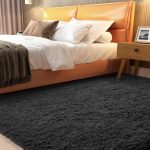 Ophanie 3x5 black fluffy rug in a cozy college dorm room
