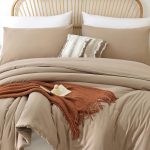 ROSGONIA queen comforter set in taupe brown with boho tan design on a bed