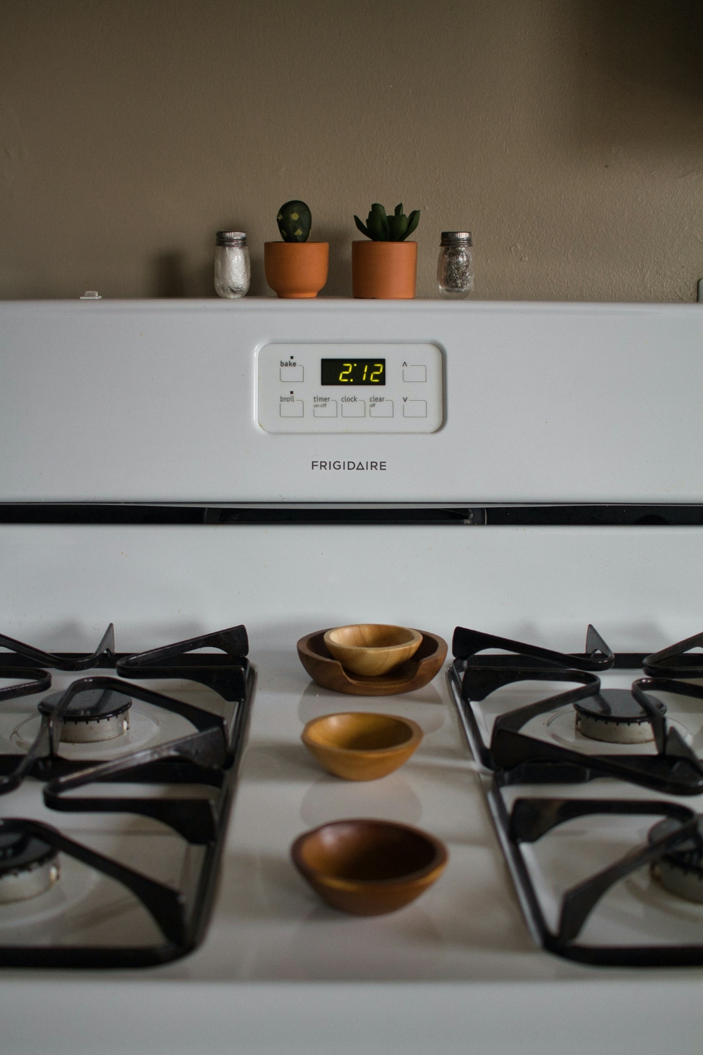 Smart thermostat mounted on a kitchen wall for temperature control