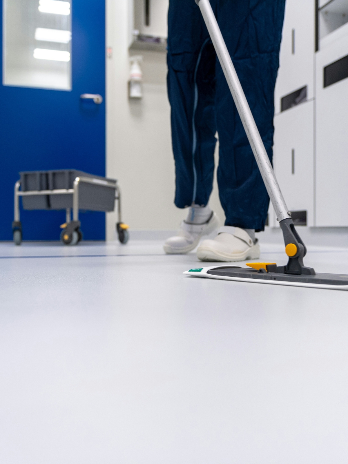 "Spot cleaning a wooden floor with a microfiber cloth"