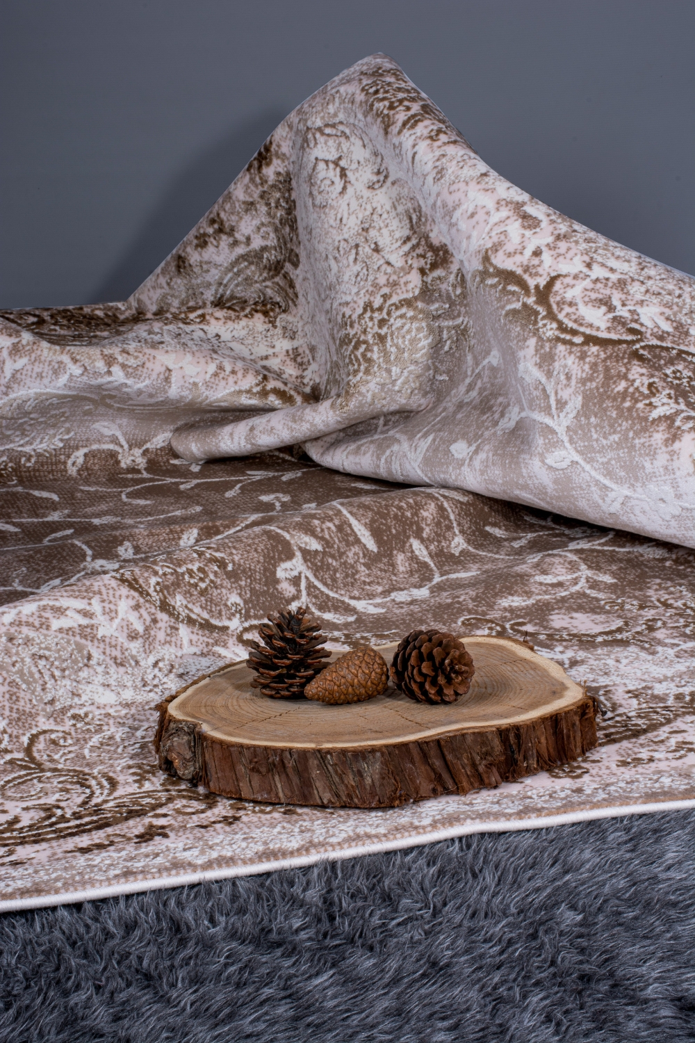 “Bedroom with layered bedding and textured fabrics”