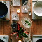 “Spring dining table decoration with candles and floral centerpiece”