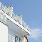 Warm LED string lights illuminating a cozy balcony at night