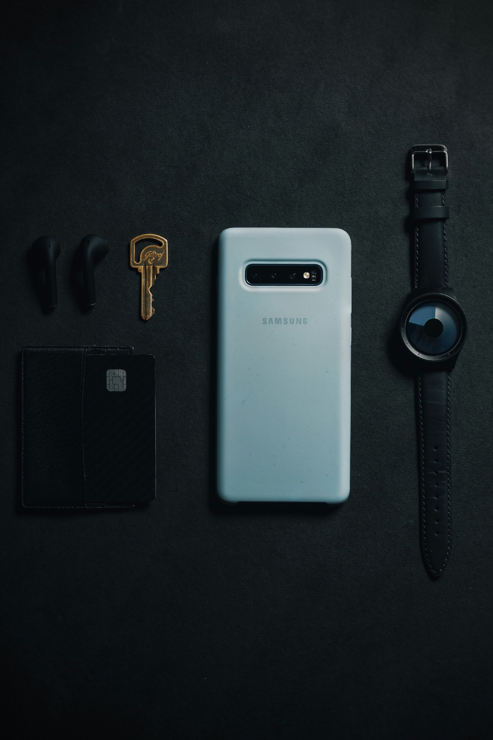 “Living room styled with cushions, throws, and vases to add personality and unify furniture styles.”