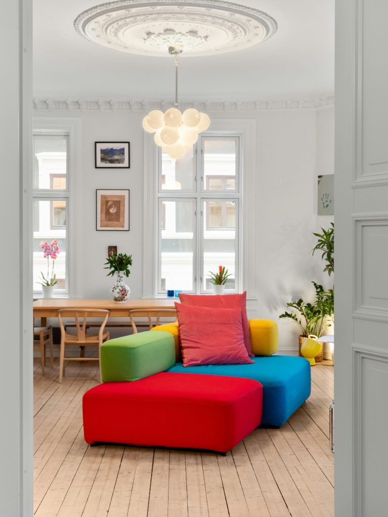 “White and beige color combination for small living room with natural light”