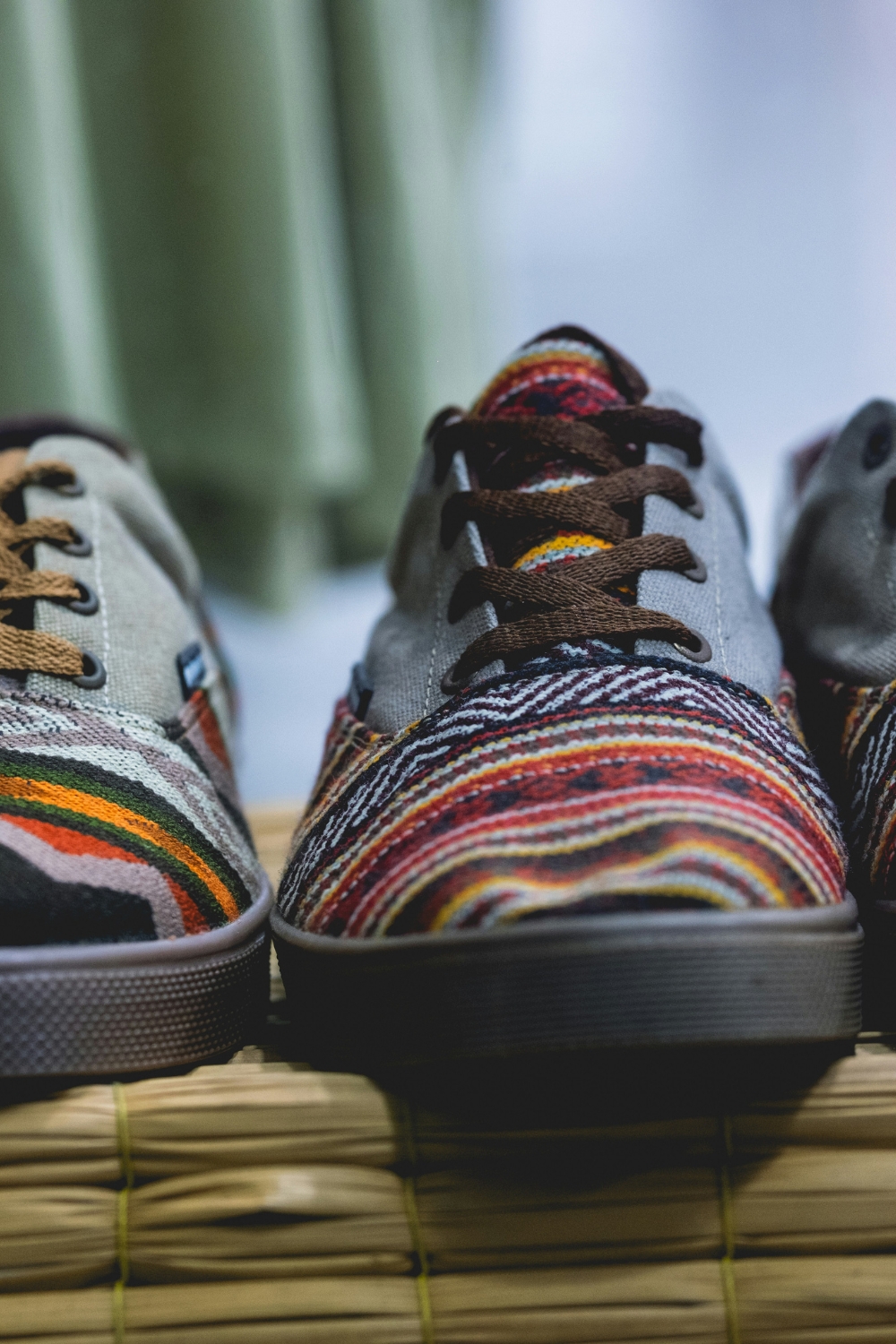 Bohemian living room with layered rugs, colorful pillows, and eclectic furniture