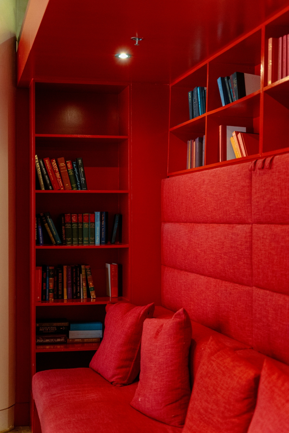 “Cozy reading nook with comfortable armchair and side table in home corner”