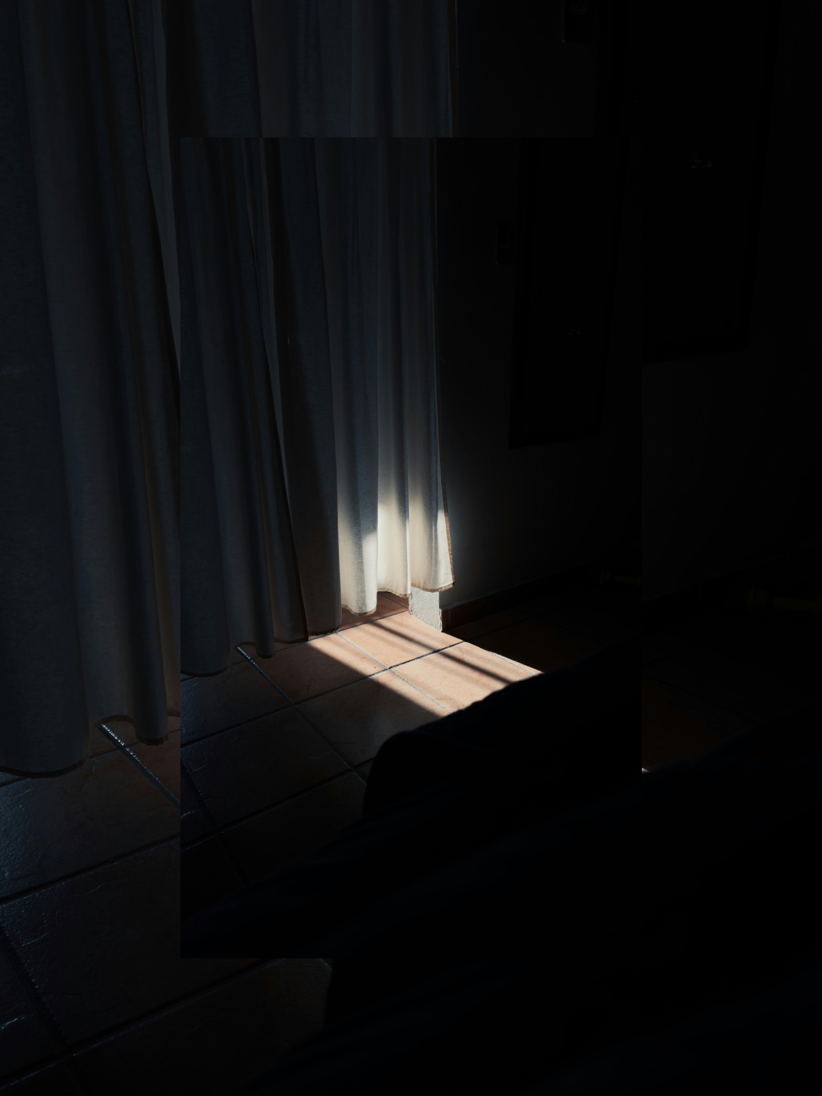 “Luxury living room filled with natural light from large windows and sheer curtains”