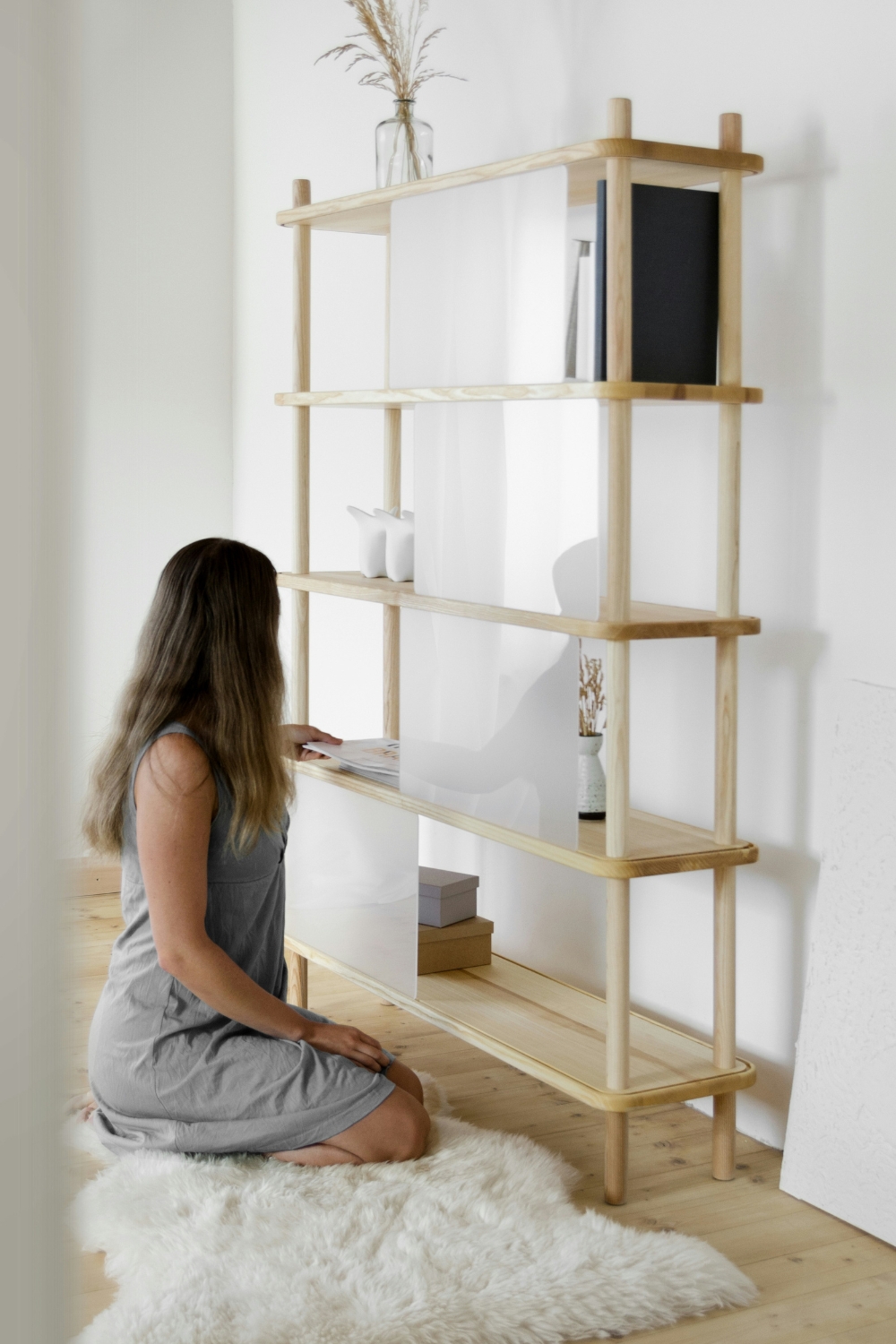 Floating shelves on a living room wall – “Budget-friendly floating shelves for small living room storage and decor.”