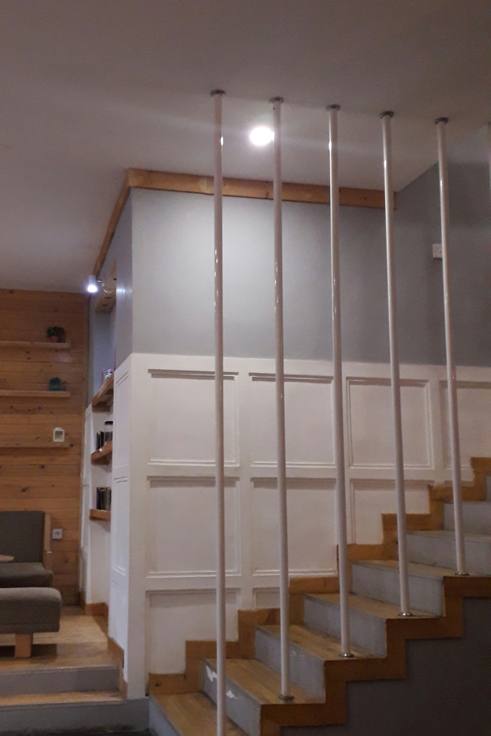 “Modern floating shelves with wall hooks for small apartment storage”