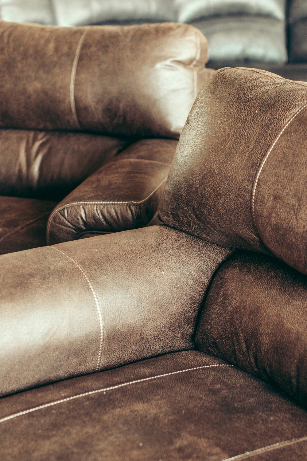 โModern beige sectional sofa in bright living room with natural lightโ