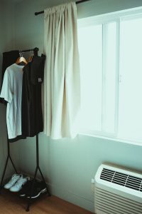 “Drying clothes indoors with natural airflow during monsoon”
