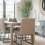 “Modern living room mixing mid-century furniture with rustic wooden accents.”