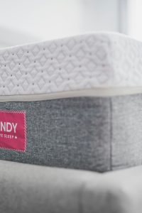 “Hybrid mattress combining memory foam and innerspring coils for comfort and support”