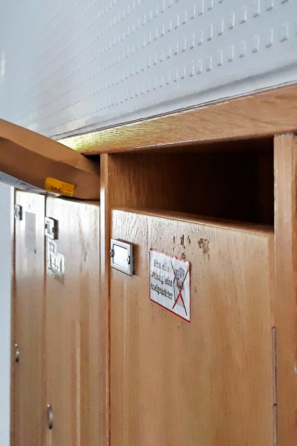 “Installed corner cabinet maximizing storage and enhancing living room décor”