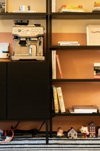 “functional and clutter-free reading nook with organized storage baskets”