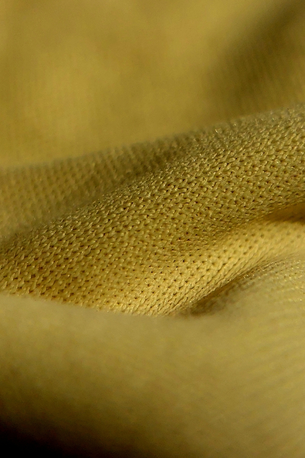 “Plush throw and knitted blankets layered on a sofa for cozy winter décor”