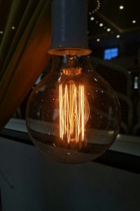 “cozy reading nook with LED floor lamp and warm ambient lighting”