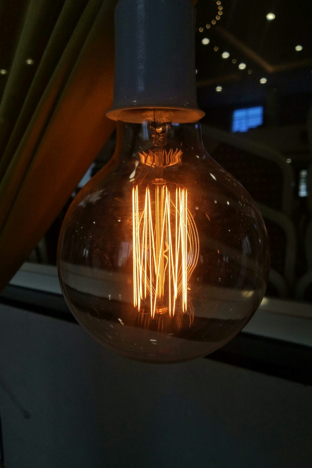 “cozy reading nook with LED floor lamp and warm ambient lighting”