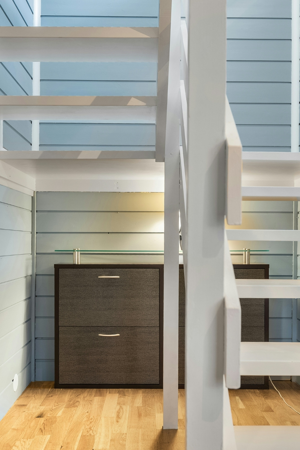 “Modern loft bed maximizing vertical space in small studio apartment”