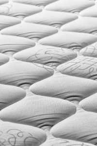 “Memory foam mattress contouring to body for pressure relief”