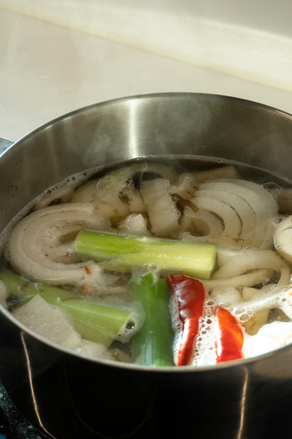 “Natural ingredients boiling with citrus and herbs for eco-friendly home fragrance”