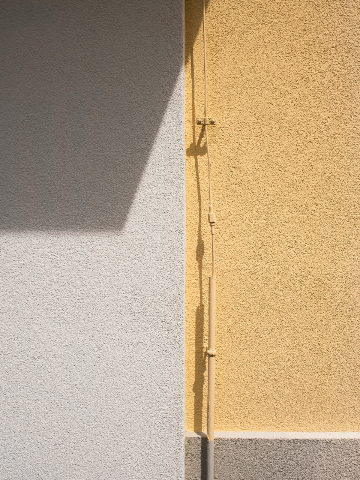 Living room wall overloaded with artwork