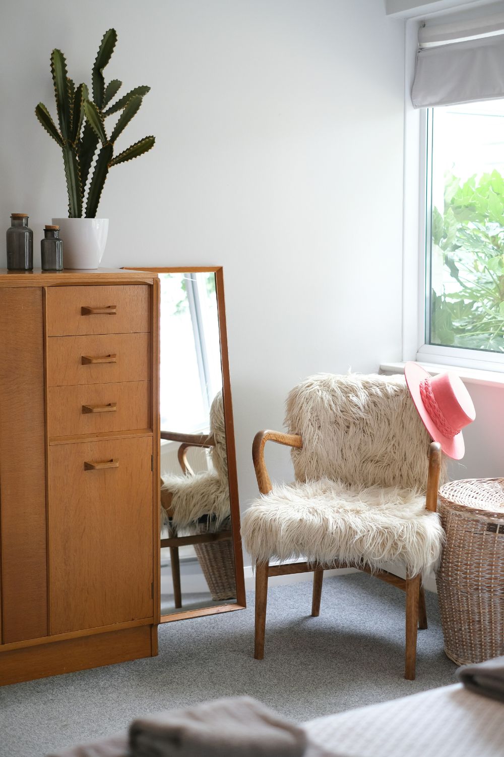 Old armchair with a new slipcover – “Budget-friendly small living room furniture update with slipcovers.”