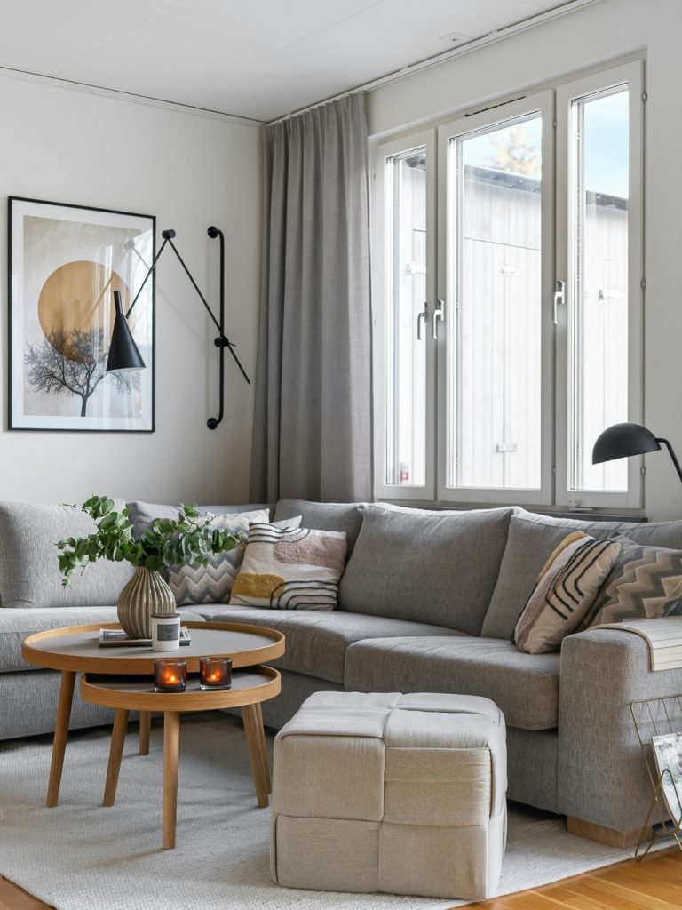 Living room with light-colored walls and small furniture – “Budget-friendly small living room decor with light colors and multi-functional furniture.”