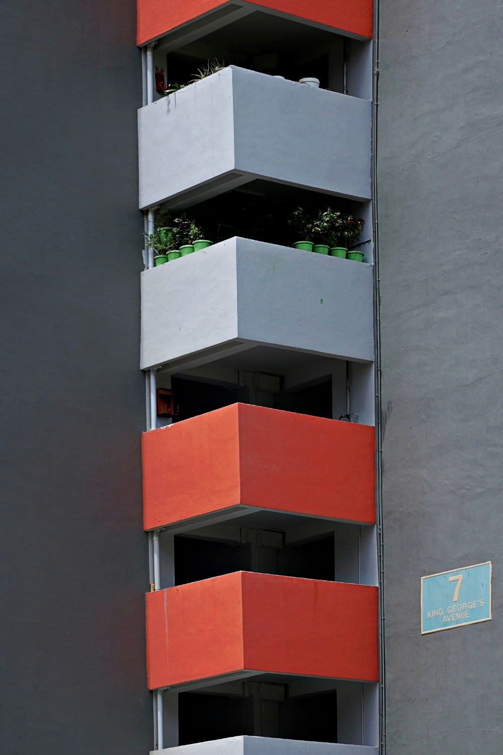 “Tall bookshelf maximizing vertical storage in a small living room”