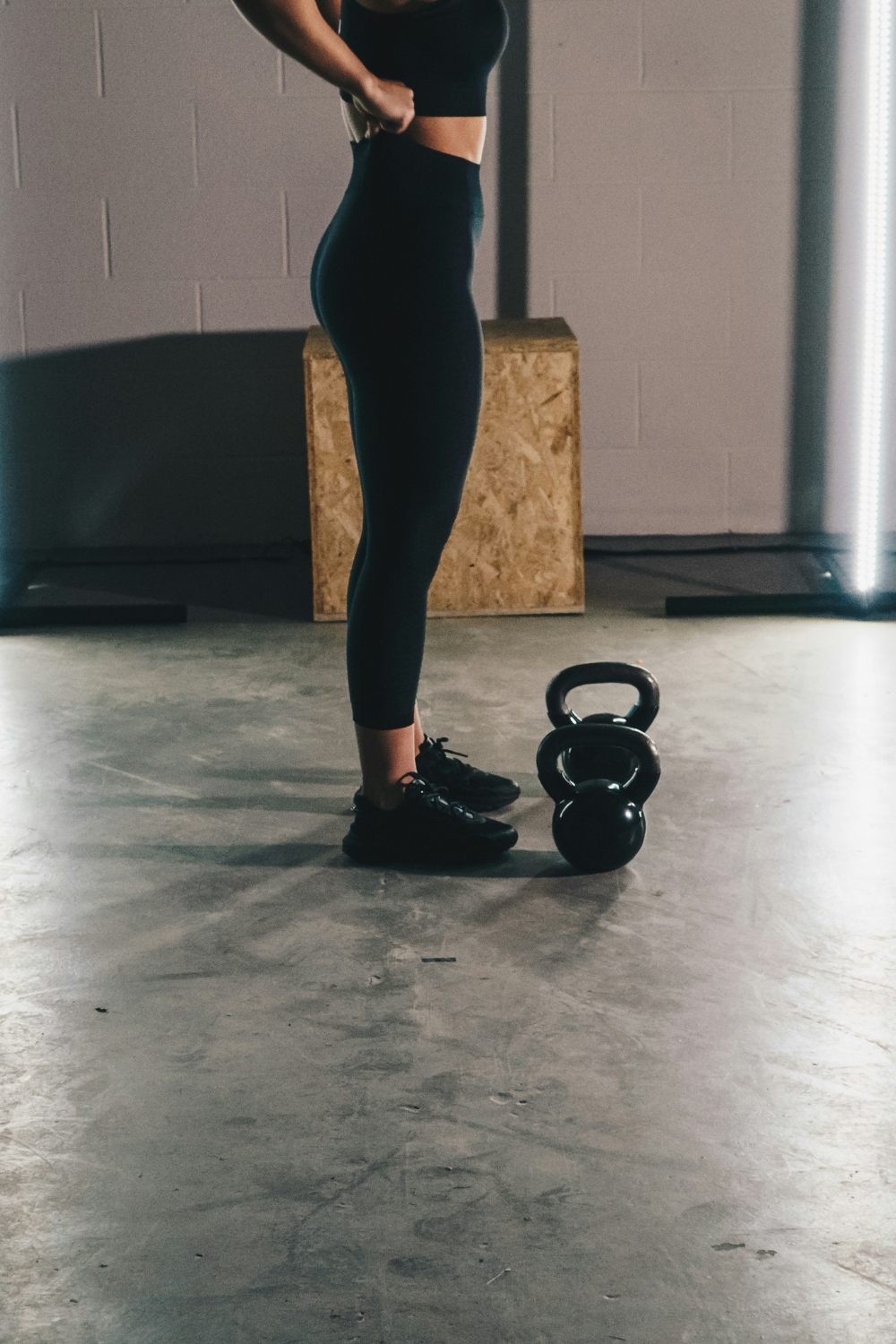 Person lifting lightweight metal chair vs heavy wooden chair
