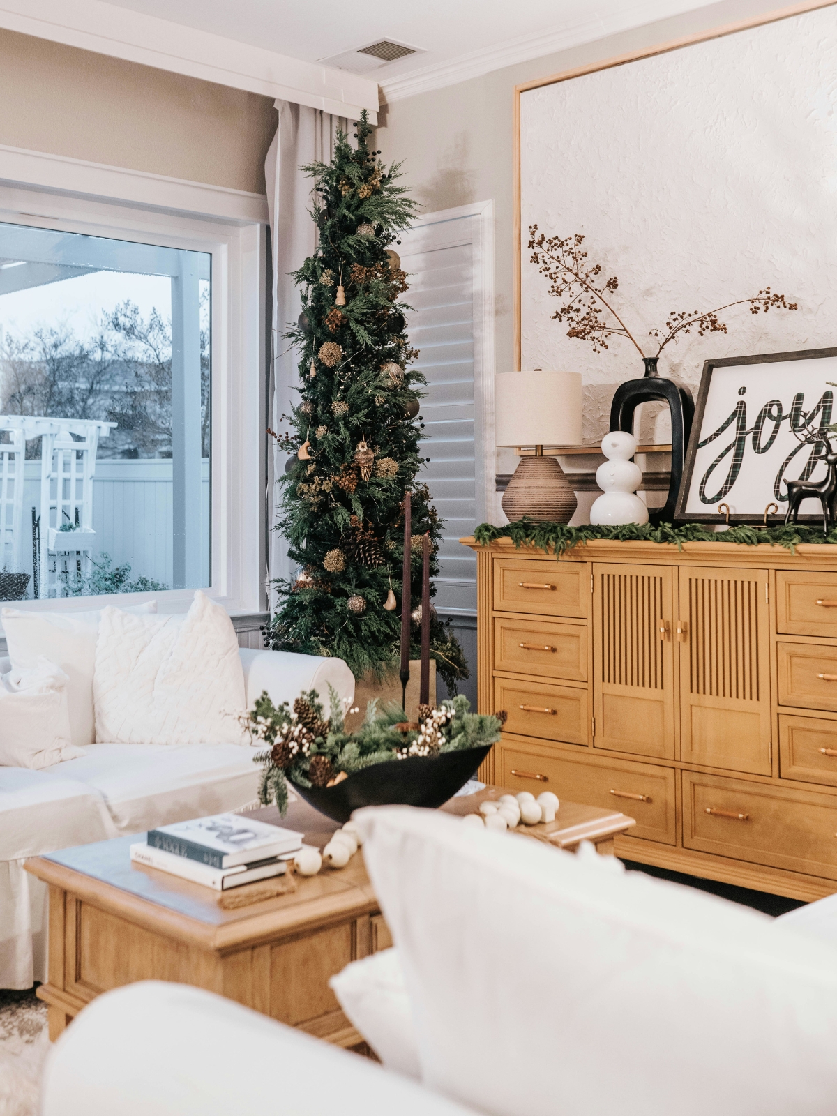 “Cozy living room with winter décor and warm lighting”