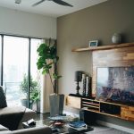 Modern living room with layered lighting and neutral color palette for an expensive look