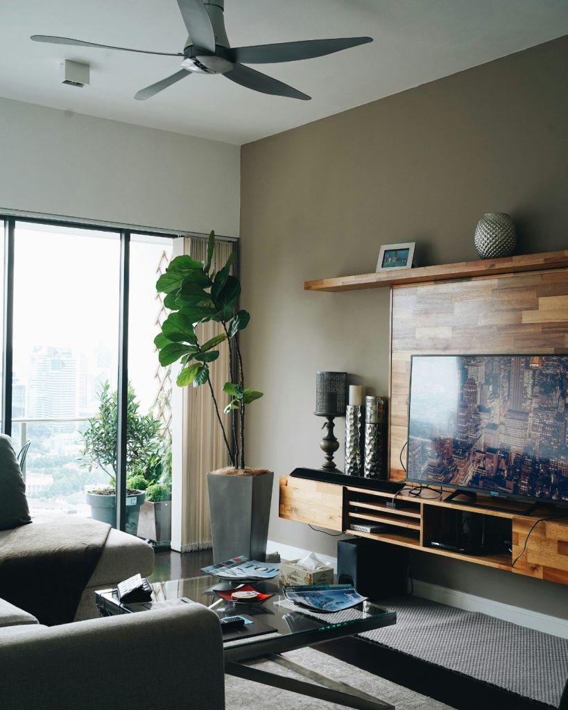 Modern living room with layered lighting and neutral color palette for an expensive look