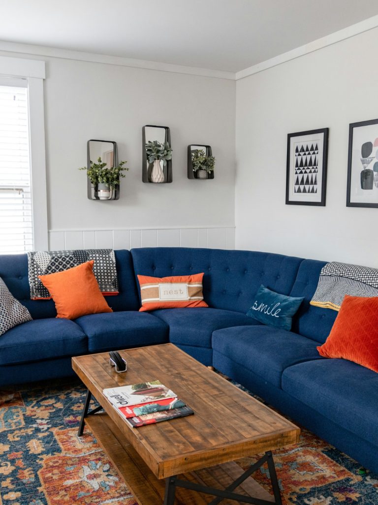 Budget-friendly living room decor upgrade with modern lighting and DIY wall art