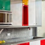 Modern white and wood kitchen design with minimalist color-themed décor.