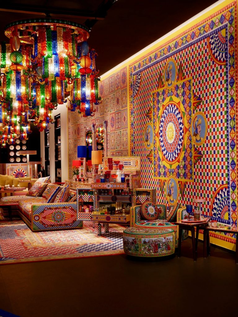 Living room decorated with cultural and heritage inspired décor featuring traditional artwork and handcrafted textiles