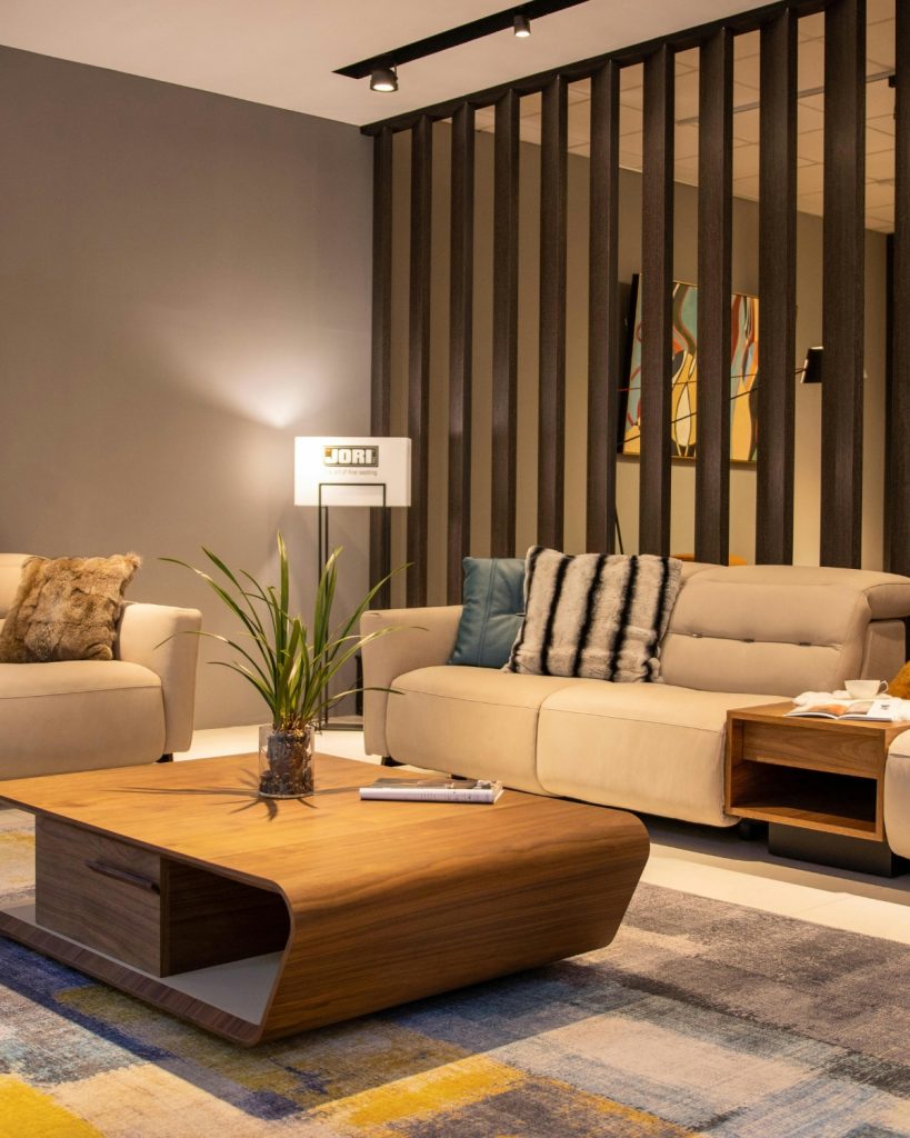 Luxury living room decorated on a budget with neutral tones, layered textures, and modern high-end accents