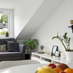 Modern smart living room interior with ambient lighting, smart speakers, and minimalist décor integration.