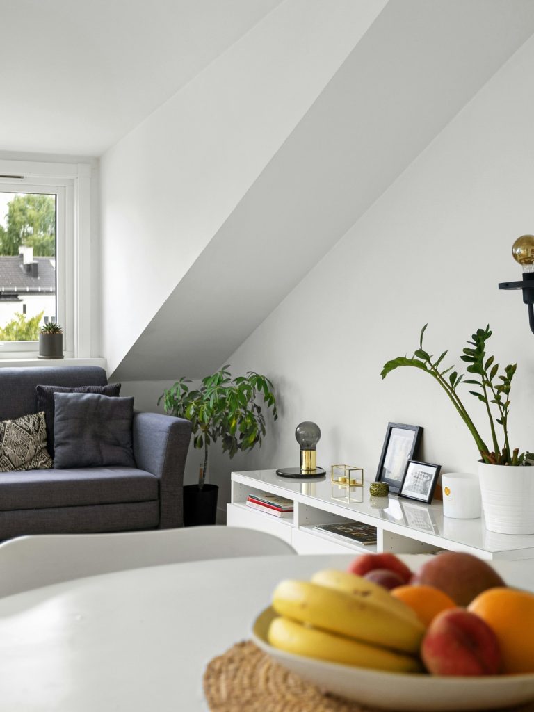 Modern smart living room interior with ambient lighting, smart speakers, and minimalist décor integration.