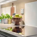 Compact kitchen with smart storage solutions and multifunctional island