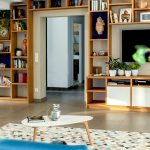 Cozy small living room with space-saving furniture and light color palette